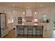 Modern kitchen featuring white cabinets, stainless steel appliances, and an island with seating at 8 Ripplewood Trl, Euharlee, GA 30145