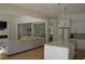 Open-concept living area featuring a modern kitchen with white cabinetry, an island and a living room at 8 Ripplewood Trl, Euharlee, GA 30145