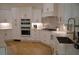 Modern kitchen featuring stainless steel appliances and white cabinets at 8 Ripplewood Trl, Euharlee, GA 30145