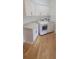 Laundry room with white cabinets, countertops, and appliances at 8 Ripplewood Trl, Euharlee, GA 30145