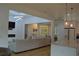 Open floor plan living room boasts fireplace, modern lighting, and easy access to the kitchen and dining area at 8 Ripplewood Trl, Euharlee, GA 30145