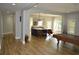 Open floor plan featuring hardwood floors, a modern kitchen, and a billiards table at 8 Ripplewood Trl, Euharlee, GA 30145