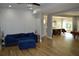 Bright and airy living room with hardwood floors, an open floor plan, and stylish blue furniture at 8 Ripplewood Trl, Euharlee, GA 30145