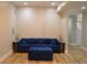 Cozy living room featuring a comfortable sofa, plush ottoman, and stylish decor, perfect for relaxation at 8 Ripplewood Trl, Euharlee, GA 30145