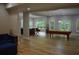 Open concept living area with kitchen, pool table, and stylish furnishings at 8 Ripplewood Trl, Euharlee, GA 30145