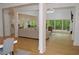 Bright living room with hardwood floors, large windows, and comfortable seating at 8 Ripplewood Trl, Euharlee, GA 30145