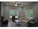 Comfortable living room with large windows, neutral colors, and stylish seating at 8 Ripplewood Trl, Euharlee, GA 30145