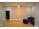 Bright living room with beautiful hardwood floors, recessed lighting, and comfortable blue sofa at 8 Ripplewood Trl, Euharlee, GA 30145
