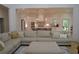 Open concept living room with a view of the modern kitchen and island seating at 8 Ripplewood Trl, Euharlee, GA 30145