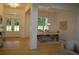 Open concept living space with wood floors featuring dining room and front entry views at 8 Ripplewood Trl, Euharlee, GA 30145