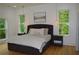 The main bedroom has ample natural light and a neutral color palette at 8 Ripplewood Trl, Euharlee, GA 30145