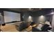 Finished theater room with large screen, projector and leather couches at 8 Ripplewood Trl, Euharlee, GA 30145
