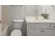 Bathroom with a modern toilet, sink with a white countertop, and brushed gold fixtures at 1200 Bay Pointe Terr Ter, Alpharetta, GA 30005