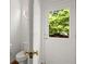 Charming powder room with toilet and backyard access at 1200 Bay Pointe Terr Ter, Alpharetta, GA 30005