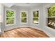 Charming breakfast nook with three windows offering views of lush greenery at 1200 Bay Pointe Terr Ter, Alpharetta, GA 30005