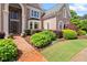 Beautiful brick home featuring a brick walkway and lush landscaping at 1200 Bay Pointe Terr Ter, Alpharetta, GA 30005