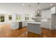 Spacious modern kitchen featuring white cabinets, a central island, and stainless steel appliances at 1200 Bay Pointe Terr Ter, Alpharetta, GA 30005
