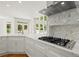 Bright gourmet kitchen with white cabinets, a gas range, and marble countertops at 1200 Bay Pointe Terr Ter, Alpharetta, GA 30005