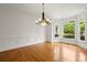 Bright living room with wood floors and bay windows at 1200 Bay Pointe Terr Ter, Alpharetta, GA 30005