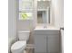Bathroom featuring gray cabinets, new countertops, and a bathtub at 1405 Attwater Dr, Atlanta, GA 30316