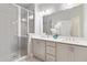 Well-lit bathroom featuring double vanity, large mirror, and walk-in shower at 1405 Attwater Dr, Atlanta, GA 30316