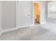 Spacious bedroom with a view into an adjacent ensuite bathroom ensuring privacy and convenience at 1405 Attwater Dr, Atlanta, GA 30316