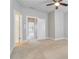 Neutral bedroom with plush carpet, open door, and ceiling fan offering a calm and inviting atmosphere at 1405 Attwater Dr, Atlanta, GA 30316