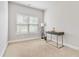 Well lit bedroom features neutral colors, a desk, and big window at 1405 Attwater Dr, Atlanta, GA 30316