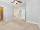 Bright bedroom featuring carpet flooring, a ceiling fan, and closet space at 1405 Attwater Dr, Atlanta, GA 30316