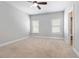 Bright bedroom featuring carpet flooring, ceiling fan, and closet space at 1405 Attwater Dr, Atlanta, GA 30316