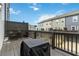 View of a private deck, complete with seating and a grill, overlooking townhome exteriors at 1405 Attwater Dr, Atlanta, GA 30316