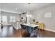 Dining area showcasing an elegant light fixture, table for four, and open-concept design at 1405 Attwater Dr, Atlanta, GA 30316
