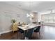 Dining area featuring hardwood floors, contemporary chandelier, and large window for natural light at 1405 Attwater Dr, Atlanta, GA 30316