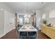 Dining area with hardwood floors, modern chandelier and access to the kitchen and pantry at 1405 Attwater Dr, Atlanta, GA 30316