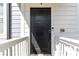 Exterior image of the front door featuring a black finish, smart lock, and traditional design at 1405 Attwater Dr, Atlanta, GA 30316