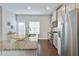 A modern kitchen boasts granite countertops, stainless steel appliances, and a stylish gold bowl at 1405 Attwater Dr, Atlanta, GA 30316
