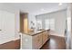 Well lit kitchen with island, stainless appliances, and hardwood floors at 1405 Attwater Dr, Atlanta, GA 30316