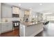 A bright, modern kitchen boasts stainless steel appliances and a granite-topped island with seating at 1405 Attwater Dr, Atlanta, GA 30316