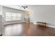 Large living room boasts sleek hardwood flooring, modern fan, and ample natural light at 1405 Attwater Dr, Atlanta, GA 30316