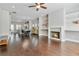 Open-concept living room with dining area, hardwood floors, fireplace, and natural light at 1405 Attwater Dr, Atlanta, GA 30316
