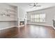 Spacious living room with hardwood floors, fireplace, custom built-ins, and plenty of natural light at 1405 Attwater Dr, Atlanta, GA 30316
