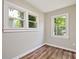 A bright and airy bedroom with large windows and hardwood floors offers a peaceful retreat at 1849 Broad Ave, Atlanta, GA 30344