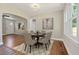 Elegant dining room with hardwood floors, a stylish rug, and plenty of natural light at 1849 Broad Ave, Atlanta, GA 30344