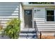 A stylish front door with decorative glass and an elegant address plaque welcomes visitors at 1849 Broad Ave, Atlanta, GA 30344
