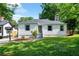 Charming single-story home featuring a well-manicured lawn and inviting front entrance at 1849 Broad Ave, Atlanta, GA 30344