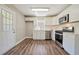 Updated kitchen featuring stainless appliances, subway tile backsplash, and white cabinetry at 1849 Broad Ave, Atlanta, GA 30344