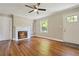 Bright living room boasts hardwood floors and a fireplace, creating a warm and inviting space at 1849 Broad Ave, Atlanta, GA 30344