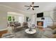 Cozy living room features a fireplace, hardwood floors, and plenty of natural light at 1849 Broad Ave, Atlanta, GA 30344
