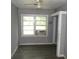 Small bedroom with a ceiling fan, a large window with an AC unit, and closet at 2172 Jernigan Drive Se, Atlanta, GA 30315