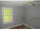 Bedroom features a window, grey walls, and a ceiling fan at 2172 Jernigan Drive Se, Atlanta, GA 30315